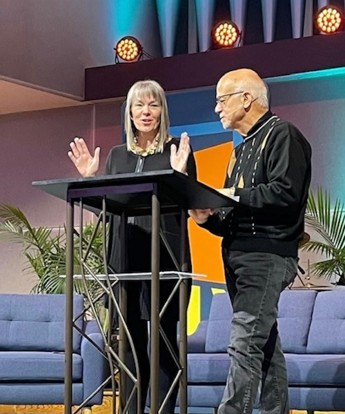 Moody Radio listeners Joe and Cindi Ferrini speaking at church